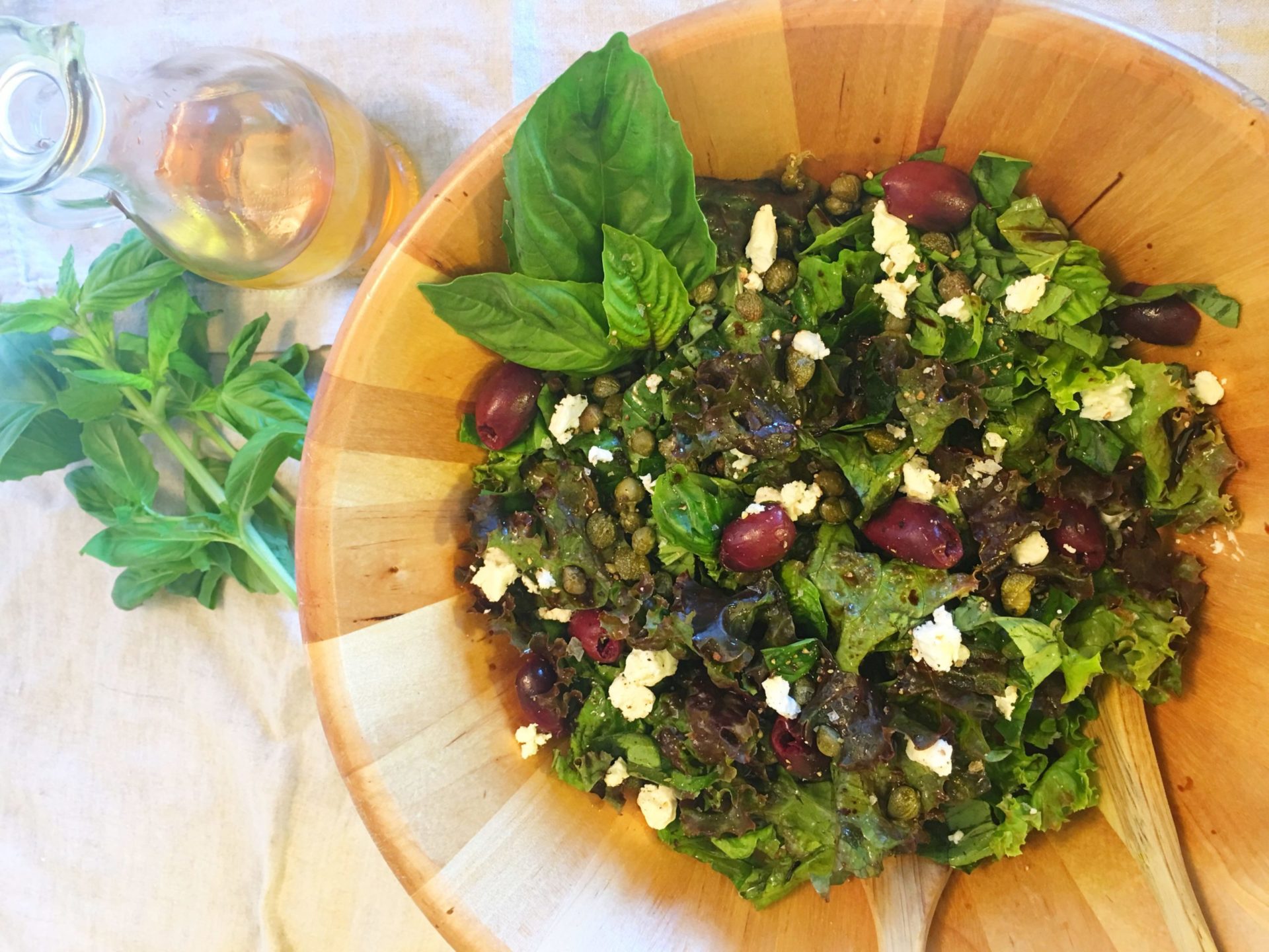 Mediterranean salad with basil, capers, olives and feta