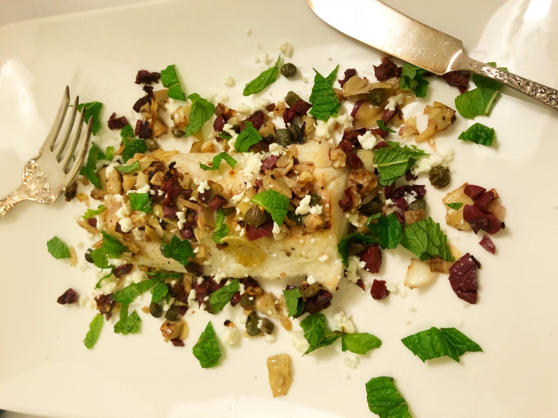 Wild cod with mint, olives and artichokes