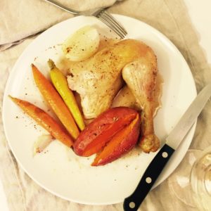 Roasted chicken with sweet potatoes, onions, carrots and garlic